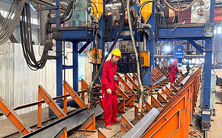 Submerged arc welding of steel components at Showhoo factory